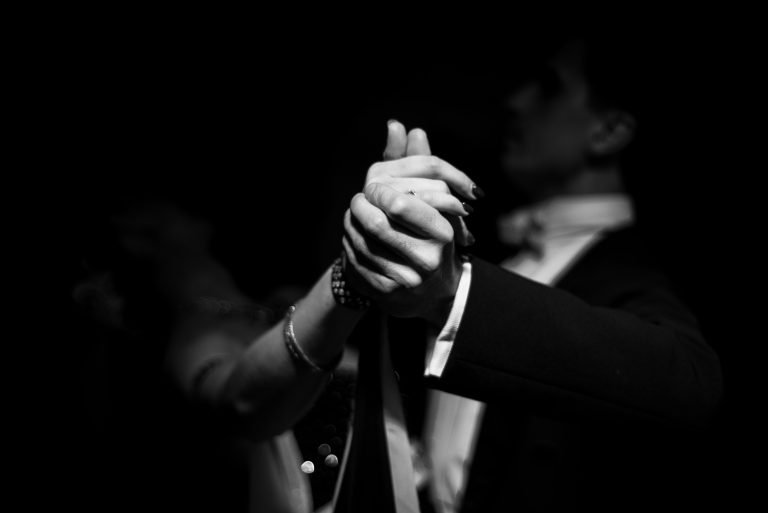 couple dancing on a dark background