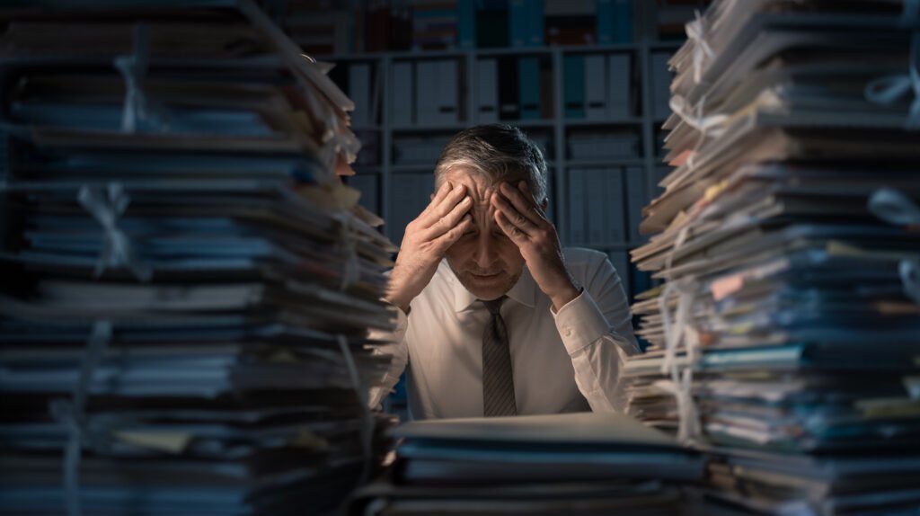 Desperate businessman working late